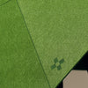 closeup of green laser cut acoustic felt used in design + conquer's Decrypt collection